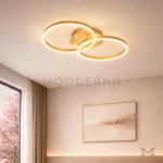 Katianna Gold instalada en sala, aportando iluminación cálida y un diseño moderno al ambiente.