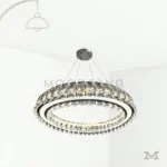 Nuria Platinum Crystal en fondo blanco, destacando su diseño circular con cristales decorativos y acabado elegante en tono plateado.