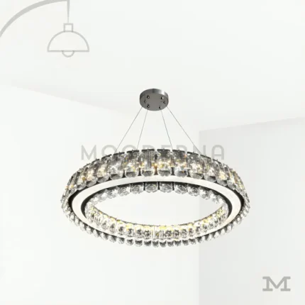 Nuria Platinum Crystal en fondo blanco, destacando su diseño circular con cristales decorativos y acabado elegante en tono plateado.