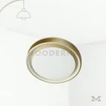 Fatima Gold en fondo blanco, destacando su diseño circular minimalista en acabado dorado satinado.