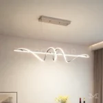 Rose Platinum en comedor desde otro ángulo, resaltando su forma ondulada y presencia visual.