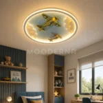 Luminaria infantil de techo con aviones y luz LED Bruno Blue Aviation en habitación moderna para niños