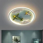 Lámpara de techo infantil Bruno Blue Aviation con aviones iluminados en dormitorio de niño