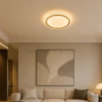 Luminaria LED circular dorada Annika Gold instalada en sala con iluminación cálida