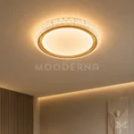 Lámpara LED de techo Annika Gold dorada en sala moderna con iluminación decorativa