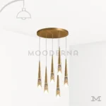 Lámpara colgante Mercy Gold de 6 luces LED con base circular dorada y diseño moderno en cascada.