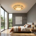 Luminaria LED Larissa instalada en dormitorio moderno con cama beige y paredes grises