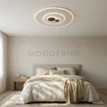 Lámpara LED Esther Mix de diseño circular instalada en el techo de un dormitorio moderno en tonos beige.